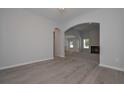 Bright dining room with hardwood floors and arched entryways at 477 Charleston Pl, Villa Rica, GA 30180