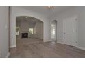 Bright dining room with hardwood floors and arched entryways at 477 Charleston Pl, Villa Rica, GA 30180