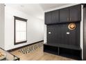 Bright foyer with a built-in bench, storage cabinets, and a geometric rug at 770 Grove Bnd, Decatur, GA 30030