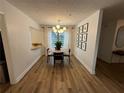 Modern dining area featuring a round table, wood floors, and stylish light fixture at 2201 Cumberland Se Ct, Smyrna, GA 30080