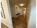 Bright entryway with wood-look floors and contemporary console table at 2201 Cumberland Se Ct, Smyrna, GA 30080