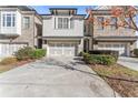 Modern townhome with gray exterior and landscaped front yard at 3939 Glenview Club Ln, Duluth, GA 30097