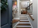 View of a wooden staircase from the foyer, leading to the upper floors at 62 Emerson Hill Sq, Marietta, GA 30060