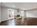 Spacious living room with hardwood floors, fireplace, and French doors at 868 E Ponce De Leon Ave, Decatur, GA 30030