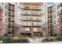 Building exterior showcasing unit #309 and courtyard at 200 River Vista Dr # 309, Atlanta, GA 30339