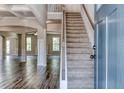 Two-story foyer with hardwood floors and a view into the living areas at 121 Frontier Way, Mcdonough, GA 30253