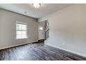 Bright living room with hardwood floors and a view of the entryway at 121 Frontier Way, Mcdonough, GA 30253