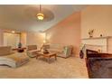 Living room with vaulted ceiling and fireplace at 160 Valley Brook Dr, Covington, GA 30016