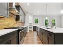 Modern kitchen features stainless steel appliances, granite countertops, and a stylish brick backsplash at 2357 Rover Ct, Atlanta, GA 30317