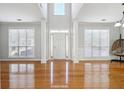 Bright living room with hardwood floors and a high ceiling at 2421 Merrion Park Ct, Dacula, GA 30019
