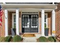 Elegant double front doors with black frames and sidelights at 1052 Brookhaven Ne Walk, Brookhaven, GA 30319