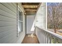 Private entrance with a wooden deck and white door at 1945 Brian Way, Decatur, GA 30033