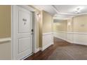 Building hallway with wood floors and neutral walls at 200 River Vista Dr # 427, Atlanta, GA 30339