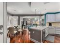 Open concept kitchen with island and hardwood floors at 200 River Vista Dr # 427, Atlanta, GA 30339