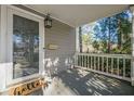 Front porch with white railing and door leading into the house at 2698 Farmstead Se Rd, Smyrna, GA 30080