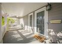 Front porch with white railing and door leading into the house at 2698 Farmstead Se Rd, Smyrna, GA 30080