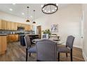 Modern kitchen with light wood cabinets and a dark blue island at 501 Dargan Sw Pl, Atlanta, GA 30310