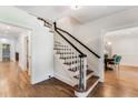 Elegant hardwood staircase in a bright and spacious entryway at 500 Westover Nw Dr, Atlanta, GA 30305