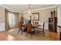 Formal dining room with hardwood floors and chandelier at 636 Parkside Village Nw Way, Marietta, GA 30060