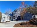 Stylish modern home with a two-car garage and wood siding at 160 Cedarwood Ln, Roswell, GA 30075