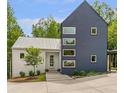 Stylish modern home showcasing unique architectural details and thoughtful landscaping at 160 Cedarwood Ln, Roswell, GA 30075