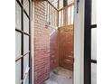 Private basement entrance with brick exterior and stairs at 272 14Th St # 23, Atlanta, GA 30309