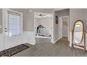 Bright entryway with wood floors and a view of a home gym at 6825 Ashford Manor Way, Cumming, GA 30040