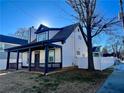 View of the home's side, showcasing the white siding and landscaping at 520 Mary Sw St, Atlanta, GA 30310