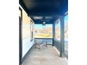 Covered porch with a ceiling fan and comfortable seating area at 520 Mary Sw St, Atlanta, GA 30310
