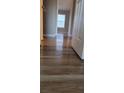 Bright hallway with wood-look flooring and neutral walls at 930 Parkway Rd, Union City, GA 30291