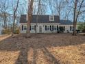 Charming home with neutral siding, black shutters, and a well-maintained lawn, offering classic curb appeal at 3640 Longfellow Trl, Marietta, GA 30062