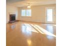 Bright and airy living room with hardwood floors, fireplace, and large windows that flood the space with natural light at 3640 Longfellow Trl, Marietta, GA 30062