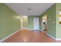 Living room with hardwood floors and access to balcony at 3599 Woodbriar Cir # G, Tucker, GA 30084