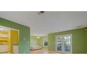 Spacious living room with light walls and French doors at 3599 Woodbriar Cir # G, Tucker, GA 30084