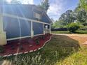 Charming one story house with blue siding and landscaped yard at 1116 Northwest Nw Dr, Atlanta, GA 30318