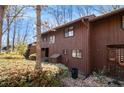 Brown wood siding townhouse exterior with walkway at 1668 Terrell Ridge Dr, Marietta, GA 30067