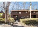 Brown wood siding townhouse exterior with walkway at 1668 Terrell Ridge Dr, Marietta, GA 30067