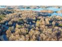Community overview with lake view and houses at 7715 Bold Springs Xing, Cumming, GA 30041