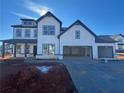 Two-story farmhouse with gray accents and a three-car garage at 2799 Porches Ln, Dacula, GA 30019