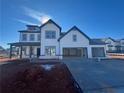 Two-story farmhouse with gray accents and a three-car garage at 2799 Porches Ln, Dacula, GA 30019