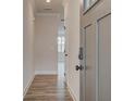Light and bright entryway with hardwood floors and modern door at 216 Depot Landing Rd # 61, Auburn, GA 30011