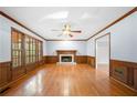 Hardwood floor living room with fireplace and built in shelving at 2269 Chimney Swift Cir, Marietta, GA 30062