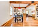 Charming dining area with hardwood floors and a view into the kitchen at 1576 Temple Ave, Atlanta, GA 30337