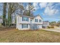 Two-story house with white siding, gray trim, and a grassy yard at 3446 Newberry Trl, Decatur, GA 30034