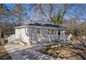 Updated ranch home with a large front yard and a long driveway at 1761 Derrill Dr, Decatur, GA 30032