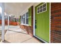 Bright green front door with a white frame and glass window at 5310 Timbo Ln, Mableton, GA 30126