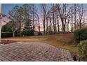 Brick paved patio and grassy backyard at 1805 Aurelia Dr, Cumming, GA 30041