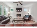 Living room featuring a fireplace and leather sofas at 667 Crosshaven Dr, Marietta, GA 30066