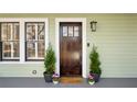 Elegant dark wood front door with glass panels and sidelights at 425 Hardendorf Ne Ave, Atlanta, GA 30307