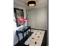 Bright foyer with black and white tile floor, a console table, and a large mirror at 1417 Doe Valley Dr, Lithonia, GA 30058